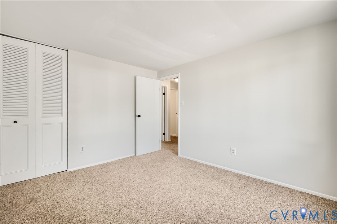 6513 Philbrook Road Richmond, VA 23234 - Photo 20 of 26 This room features light-colored walls, carpeted f
