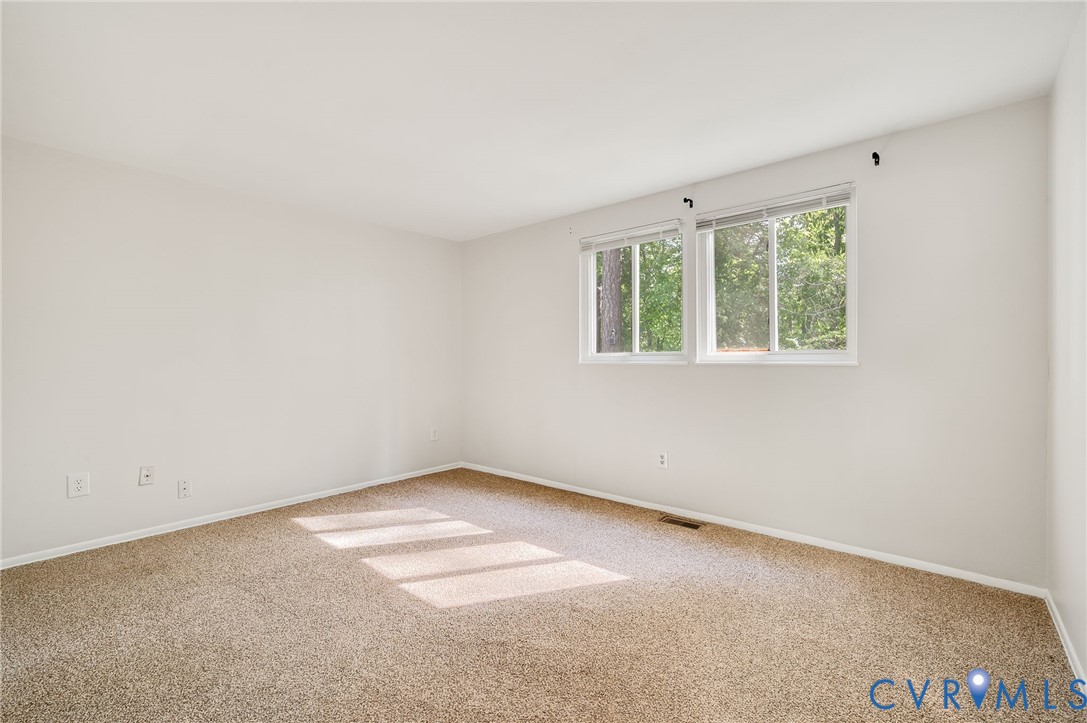 6513 Philbrook Road Richmond, VA 23234 - Photo 21 of 26 The property features a bright room with light-col