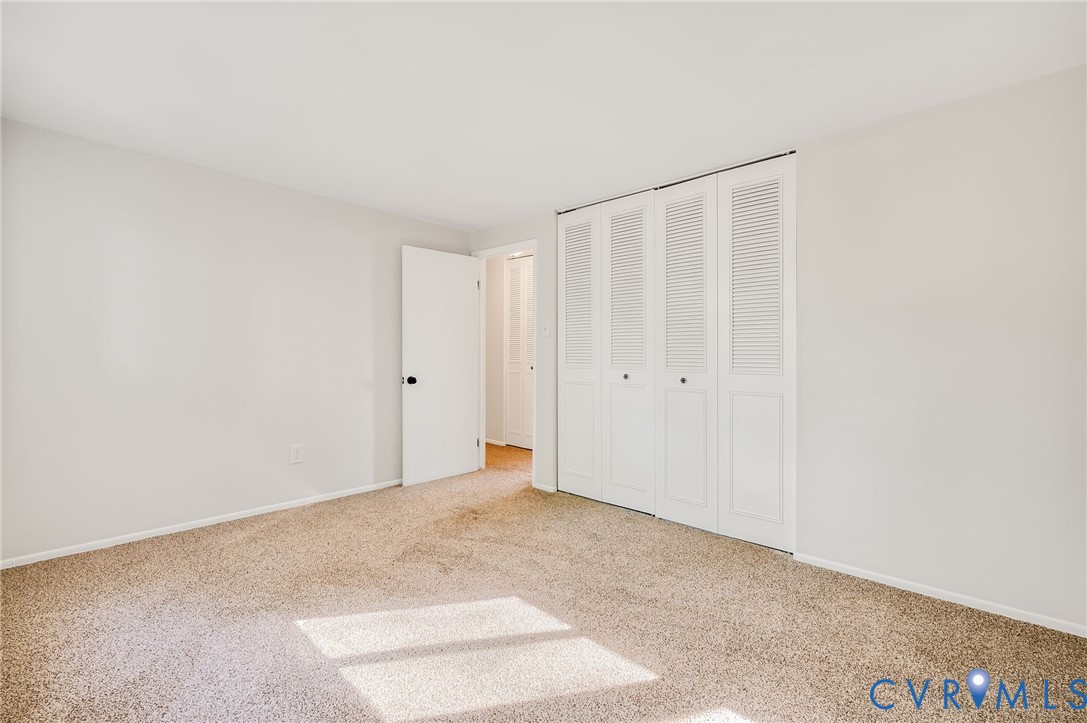 6513 Philbrook Road Richmond, VA 23234 - Photo 22 of 26 The room features light-colored carpet flooring an