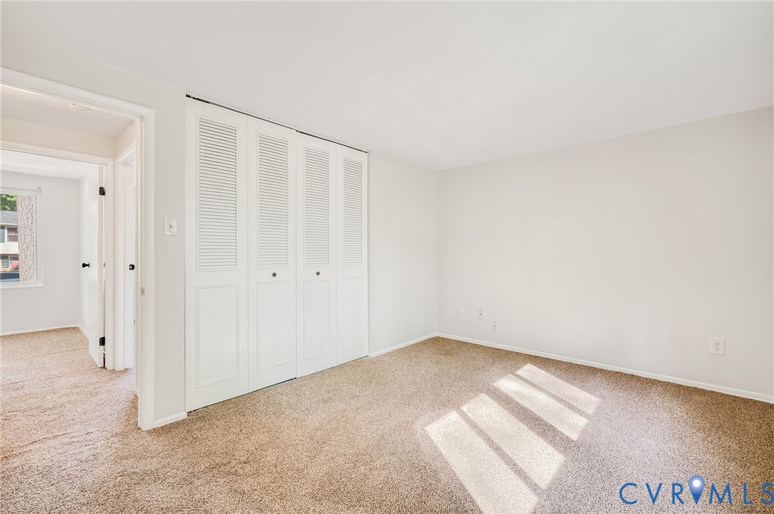6513 Philbrook Road Richmond, VA 23234 - Photo 23 of 26 This room features light-colored carpeting and whi