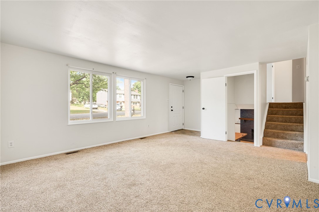 6513 Philbrook Road Richmond, VA 23234 - Photo 5 of 26 The living area features light-colored carpeting,
