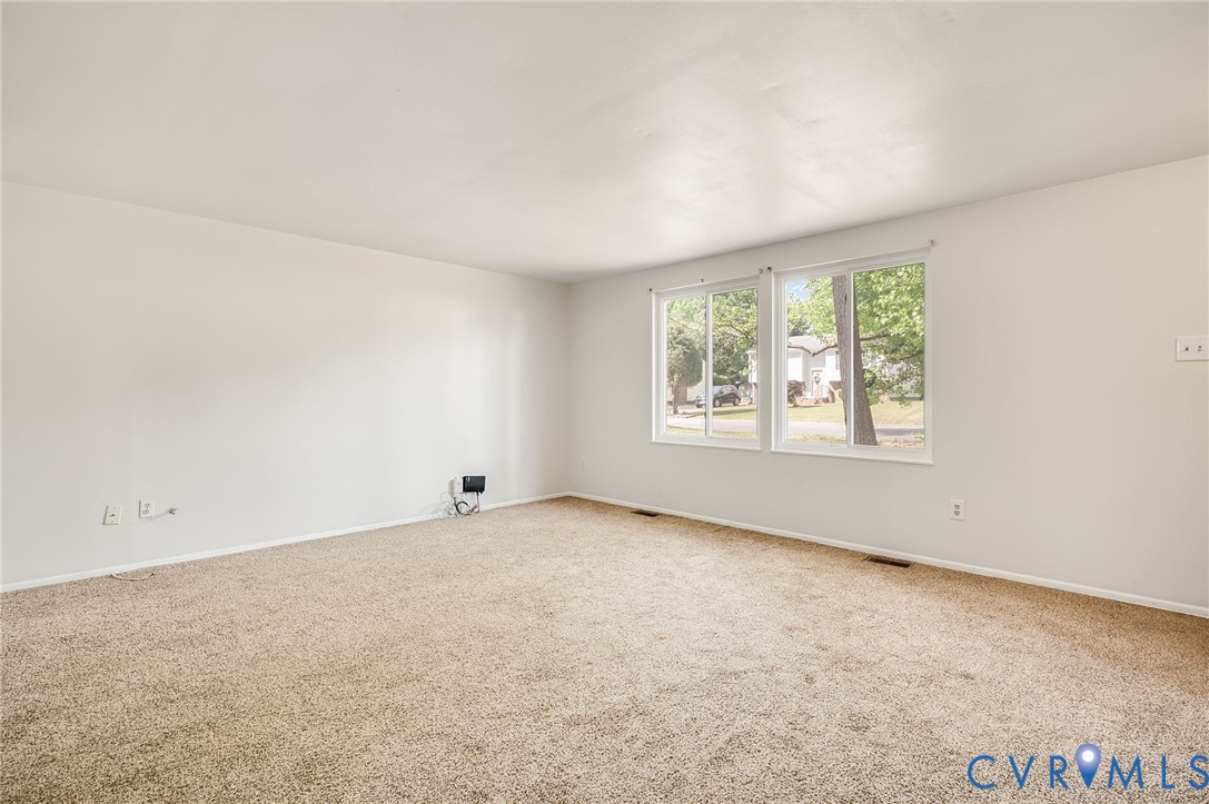 6513 Philbrook Road Richmond, VA 23234 - Photo 6 of 26 This spacious room features neutral-toned carpet f