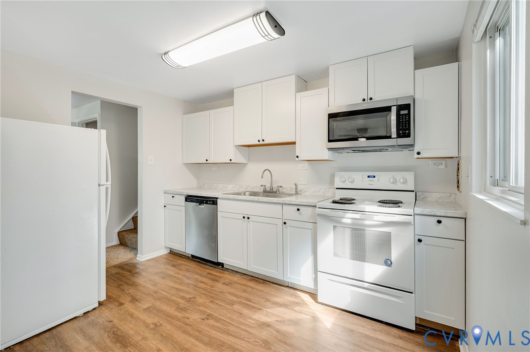 6513 Philbrook Road Richmond, VA 23234 - Photo 8 of 26 The kitchen features white cabinetry, a stainless