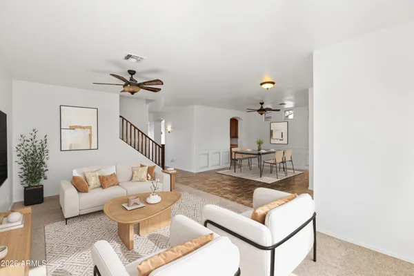 a living room with furniture and a table