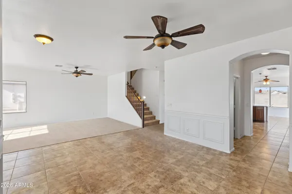 a spacious bathroom with a granite countertop sink and a mirror