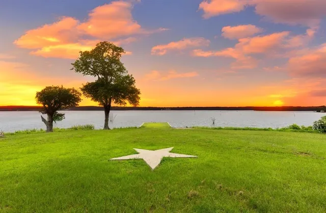 a view of a lake with a yard