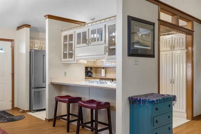 a bathroom with a double vanity sink toilet and shower
