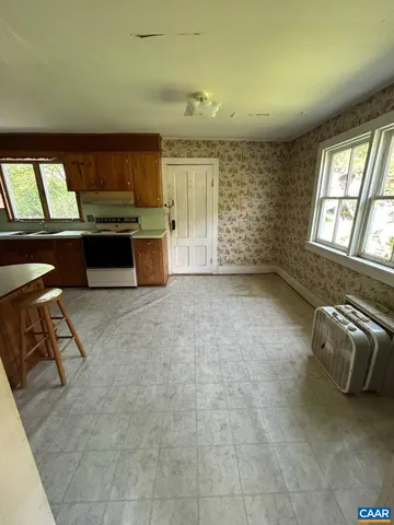 a view of a room with rack and wooden floor