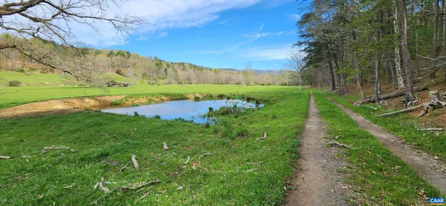 a view of a lake with a big yard
