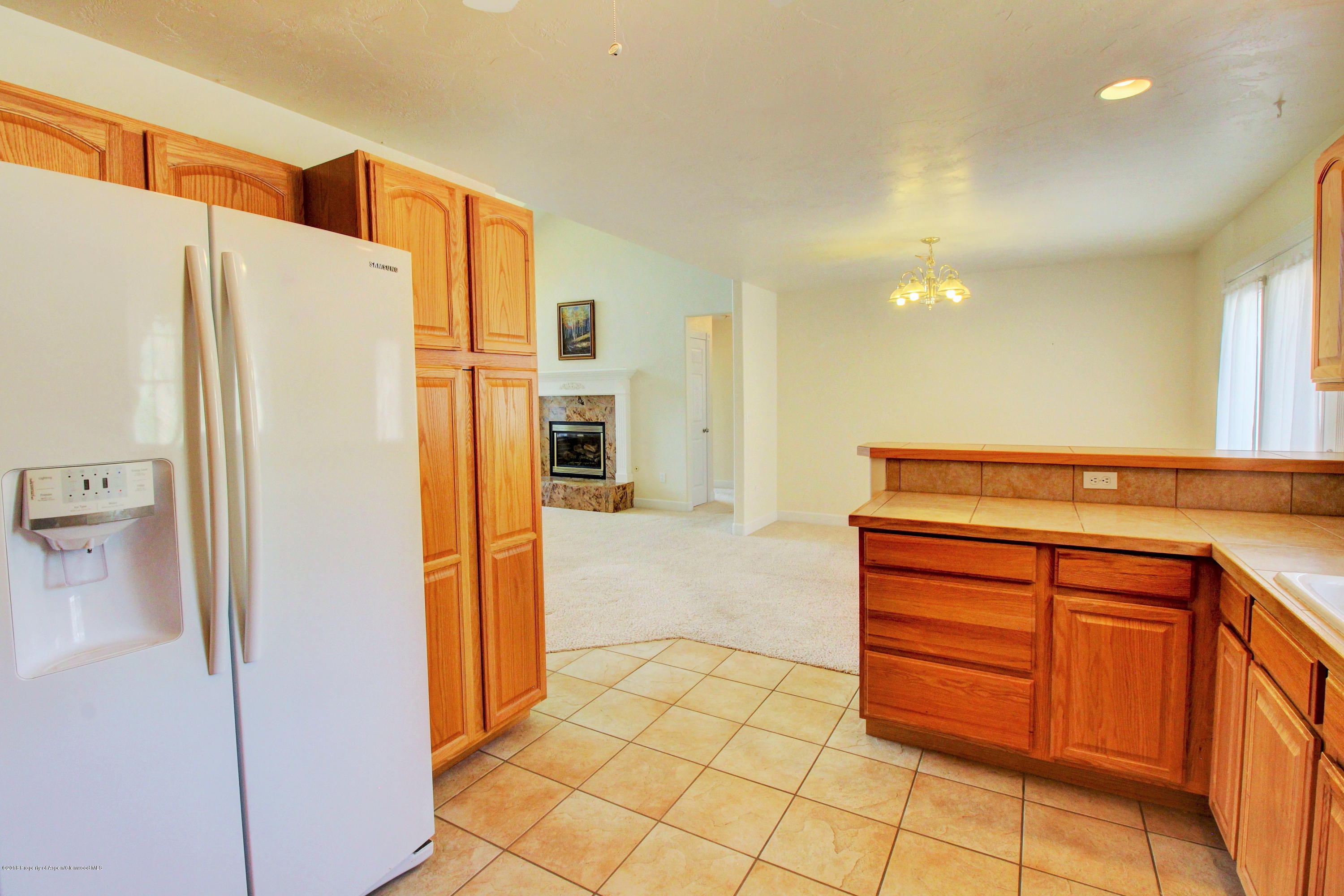 680 Birch Court Rifle, CO 81650 - Photo 11 of 36 a kitchen with stainless steel appliances a refrigerator and a stove
