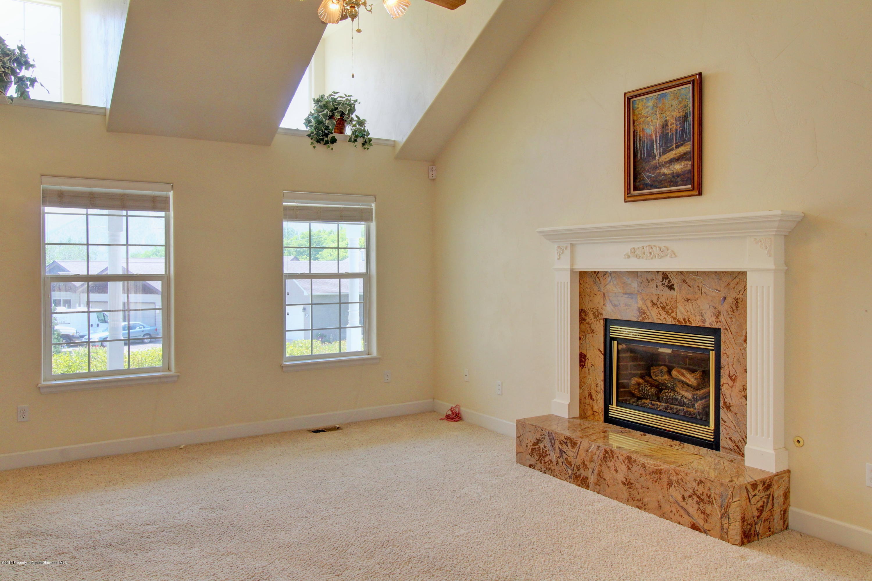 680 Birch Court Rifle, CO 81650 - Photo 13 of 36 a living room with furniture and a fireplace