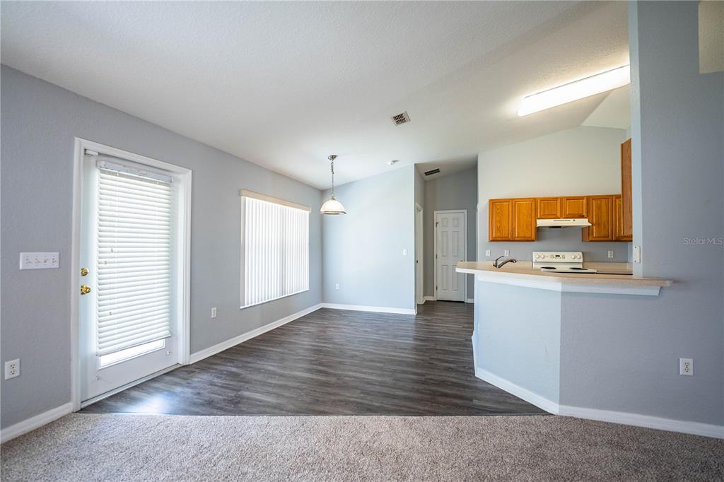 233 Towhee Road Winter Haven, FL 33881 - Photo 17 of 87 an empty room with wooden floor and a window