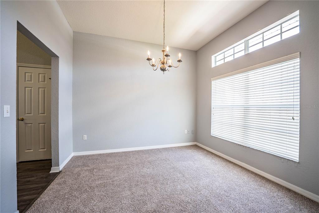 233 Towhee Road Winter Haven, FL 33881 - Photo 32 of 87 a view of a livingroom with a ceiling fan and window