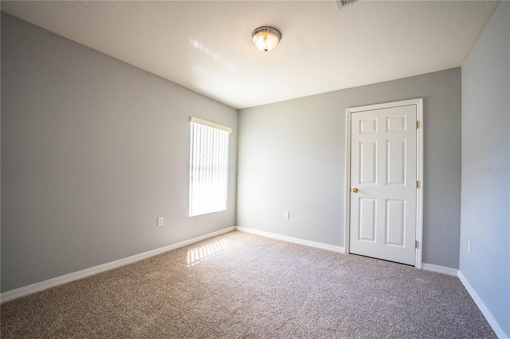 233 Towhee Road Winter Haven, FL 33881 - Photo 53 of 87 an empty room with windows and closet