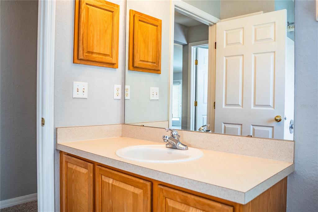 233 Towhee Road Winter Haven, FL 33881 - Photo 58 of 87 a bathroom with a sink and a mirror