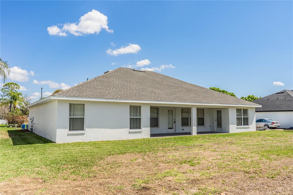 233 Towhee Road Winter Haven, FL 33881 - Photo 60 of 87 a view of a house with a backyard