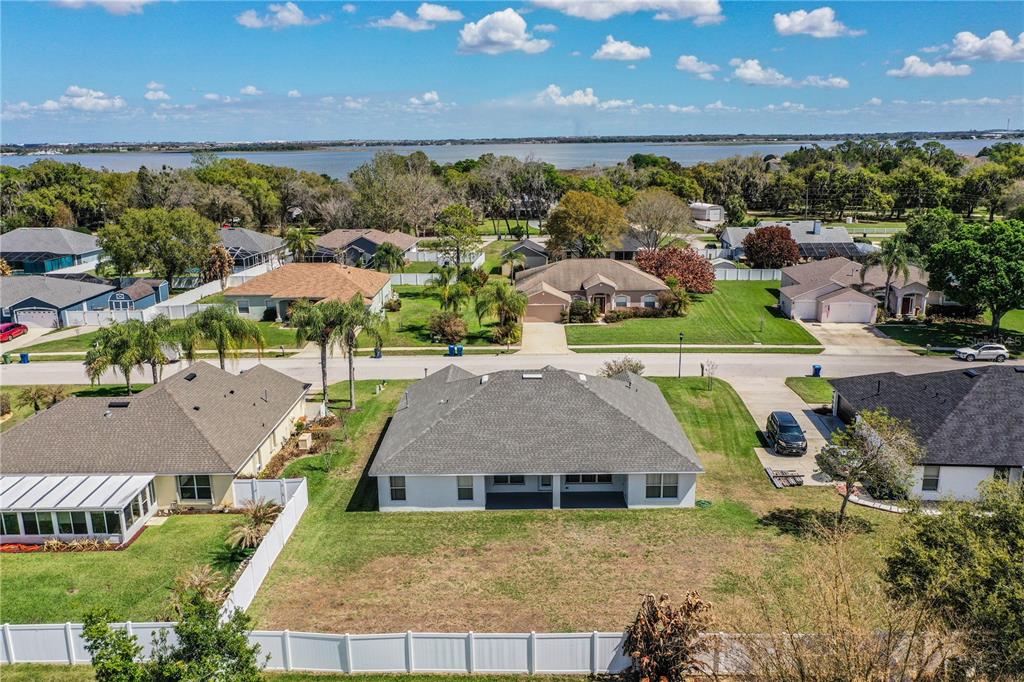 233 Towhee Road Winter Haven, FL 33881 - Photo 78 of 87 an aerial view of a house with a garden and lake view