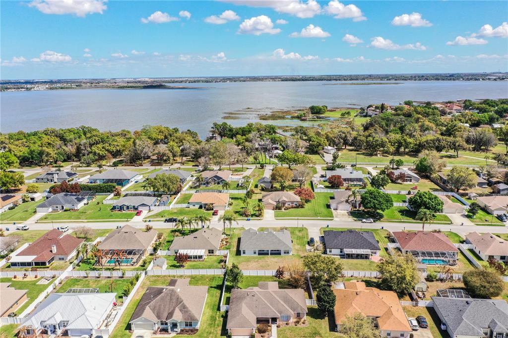 233 Towhee Road Winter Haven, FL 33881 - Photo 81 of 87 an aerial view of a building with outdoor space and ocean view