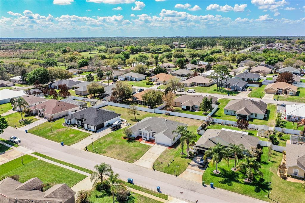 233 Towhee Road Winter Haven, FL 33881 - Photo 82 of 87 an aerial view of residential houses with outdoor space