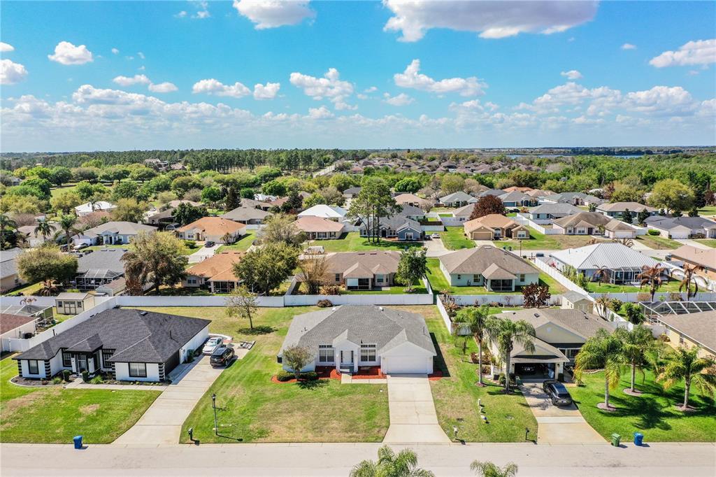 233 Towhee Road Winter Haven, FL 33881 - Photo 84 of 87 an aerial view of a house with a garden and lake view