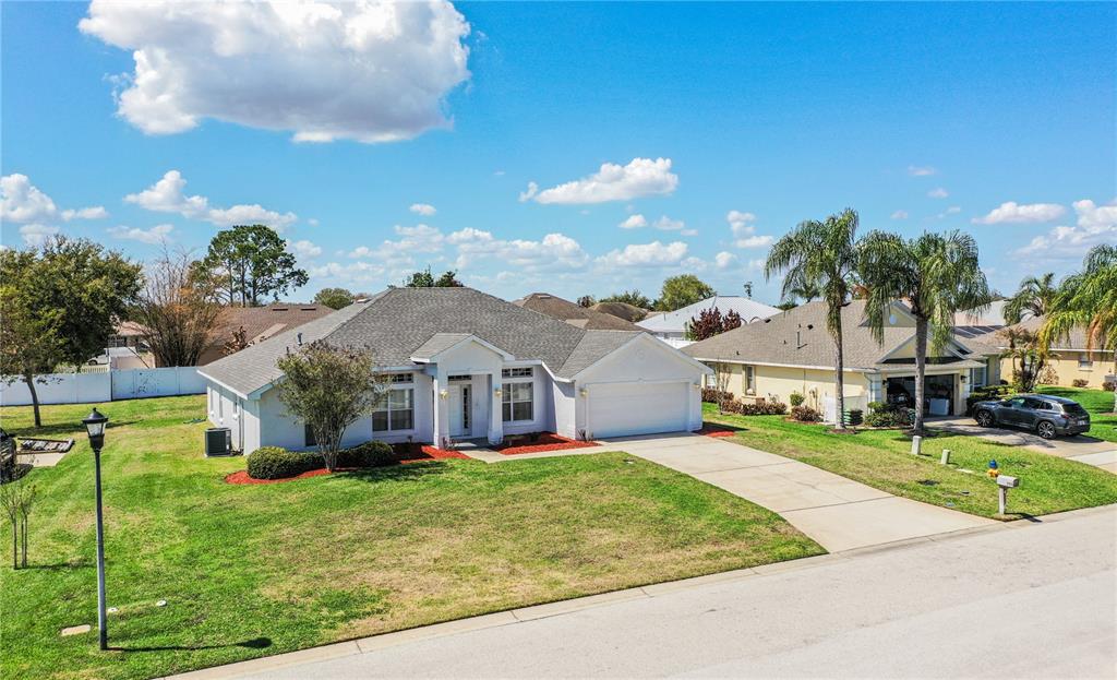 233 Towhee Road Winter Haven, FL 33881 - Photo 85 of 87 a front view of house with yard and green space