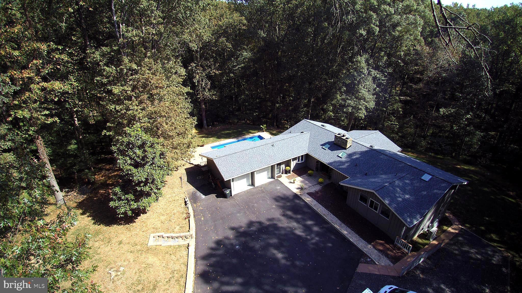 Front View of Property and Partial View of Pool
