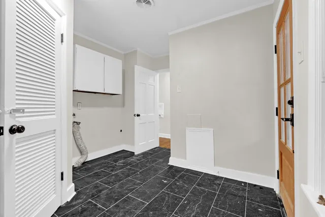 a kitchen with a sink and a refrigerator