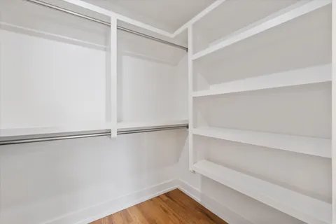 a view of an empty walk in closet