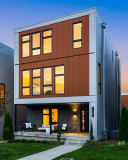 a view of brick building with a yard