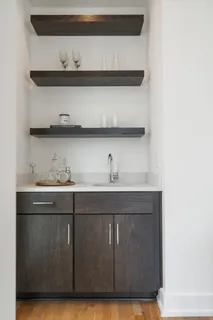 a bathroom with a sink and cabinets