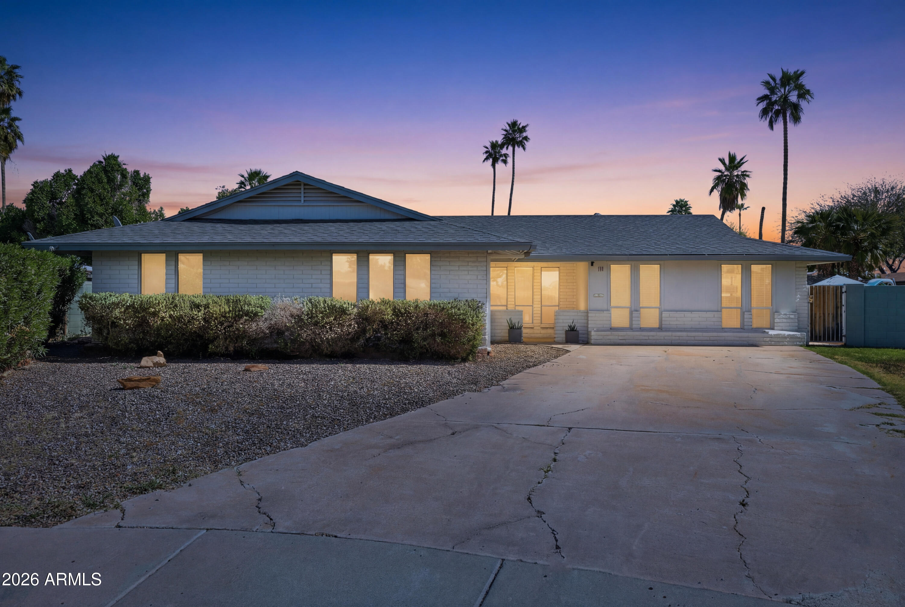 111 South Cholla Street Gilbert, AZ 85233 - Photo 32 of 34 a front view of a house with a yard and garage