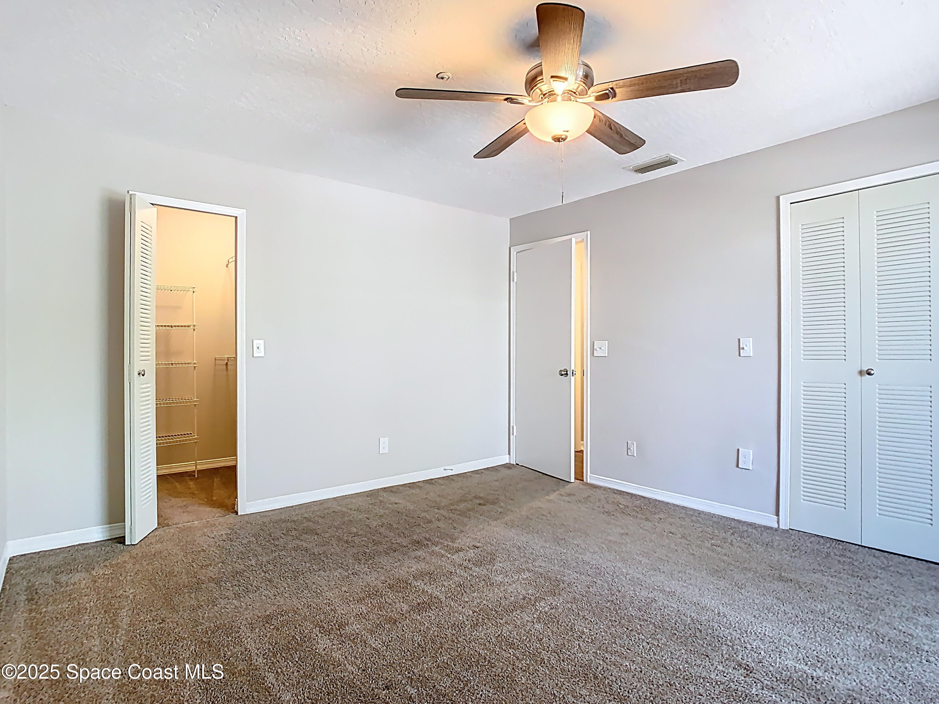 7667 North Wickham Road, Unit 721 Melbourne, FL 32940 - Photo 13 of 32 Bedroom with walk in closet