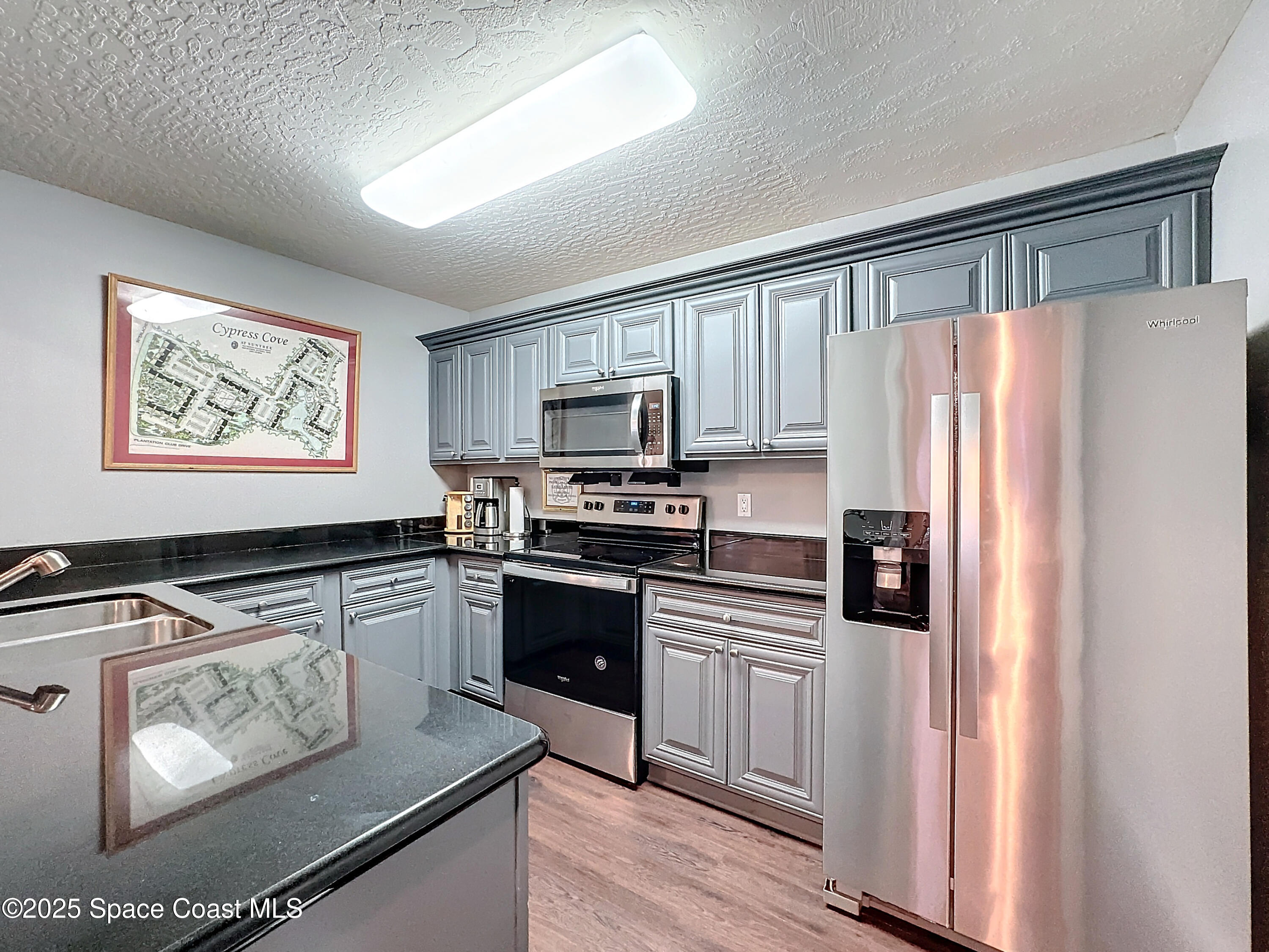 7667 North Wickham Road, Unit 721 Melbourne, FL 32940 - Photo 19 of 32 clubhouse kitchen