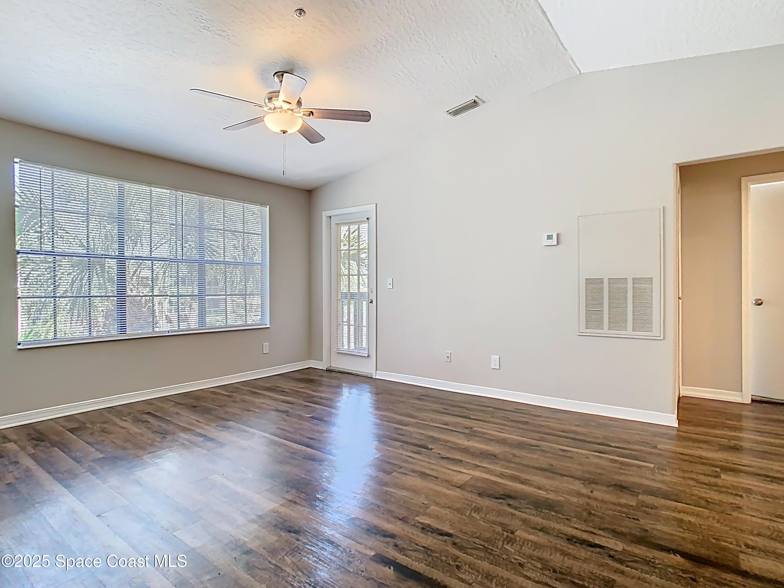 7667 North Wickham Road, Unit 721 Melbourne, FL 32940 - Photo 4 of 32 LVP flooring and vaulted ceilings