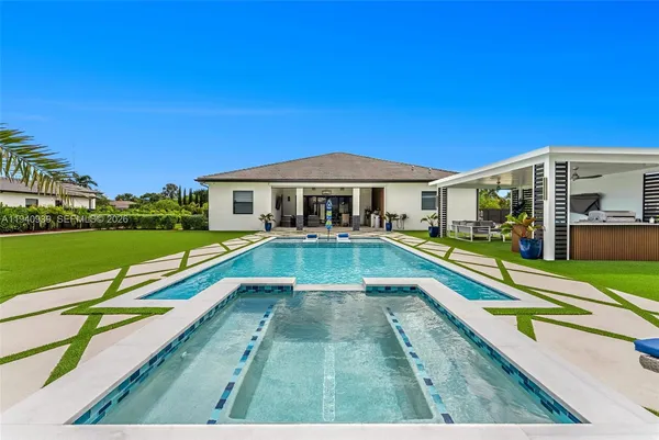 a view of a house with a big yard