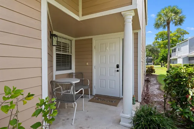 a backyard of a house with outdoor seating