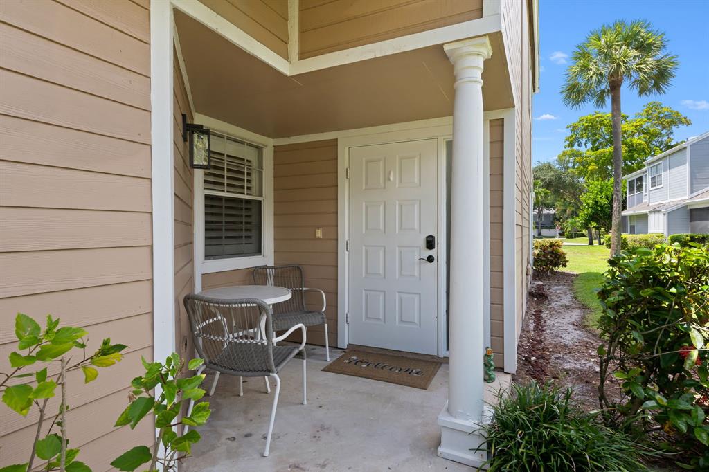 a backyard of a house with outdoor seating
