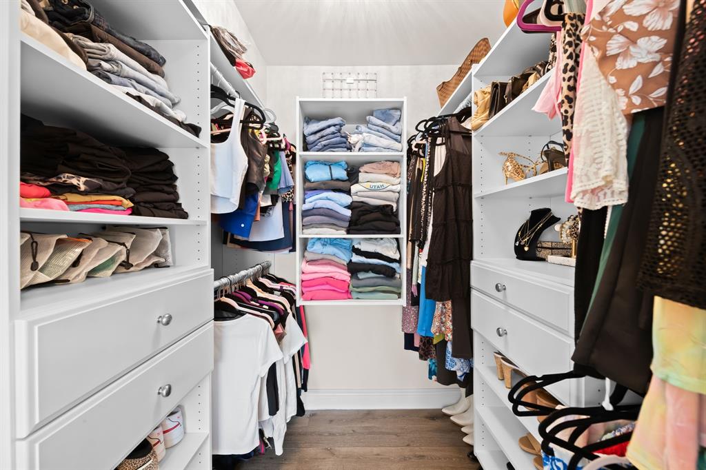 5298 Buckhead Circle, Unit 1040 Boca Raton, FL 33431 - Photo 15 of 25 a view of walk in closet with clothes and shoes
