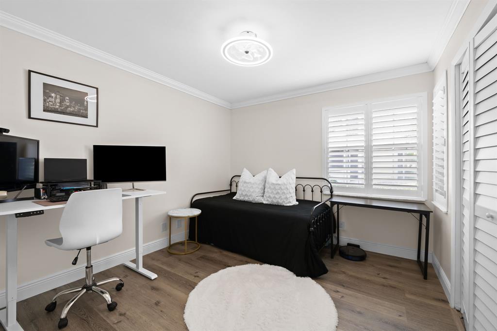 5298 Buckhead Circle, Unit 1040 Boca Raton, FL 33431 - Photo 21 of 25 a livingroom with workspace and a window