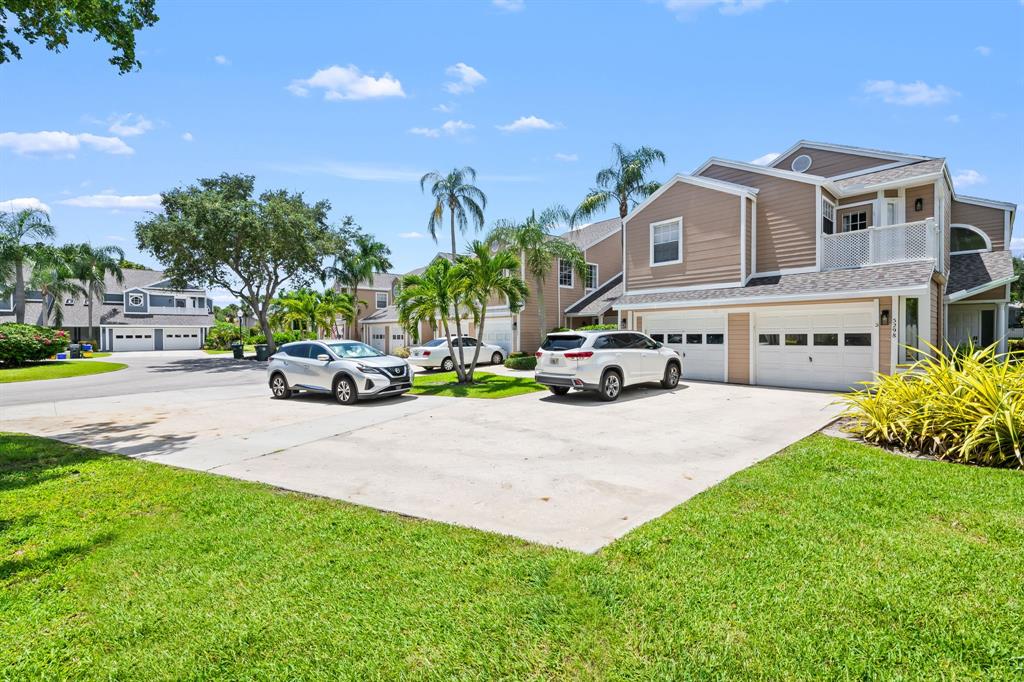 5298 Buckhead Circle, Unit 1040 Boca Raton, FL 33431 - Photo 24 of 25 a car parked in front of a house