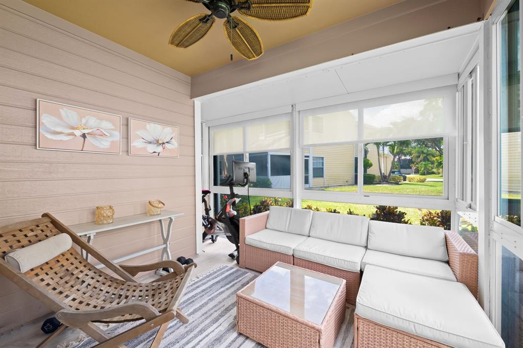 5298 Buckhead Circle, Unit 1040 Boca Raton, FL 33431 - Photo 6 of 25 a living room with furniture and a large window