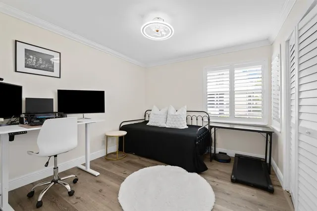 a view of a workspace with a window and lounge chair