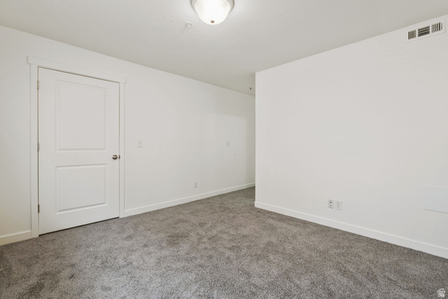 8204 North Cedar Springs Road, Unit 2 Eagle Mountain, UT 84005 - Photo 8 of 17 Spare room with baseboards and carpet
