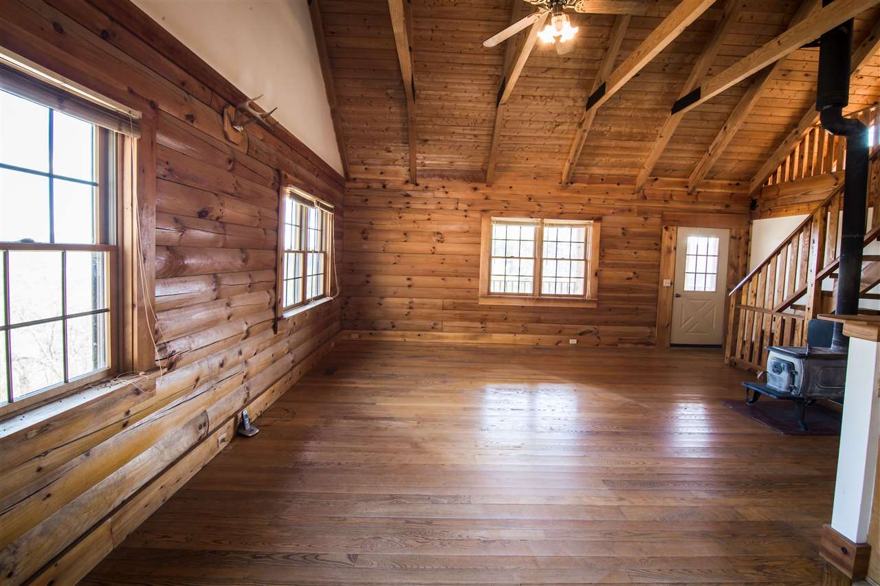919 Roman Road Mount Sidney, VA 24467 - Photo 11 of 32 a view of an empty room with wooden floor and a window