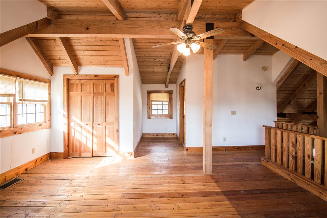 919 Roman Road Mount Sidney, VA 24467 - Photo 20 of 32 wooden floor in an empty room with a window