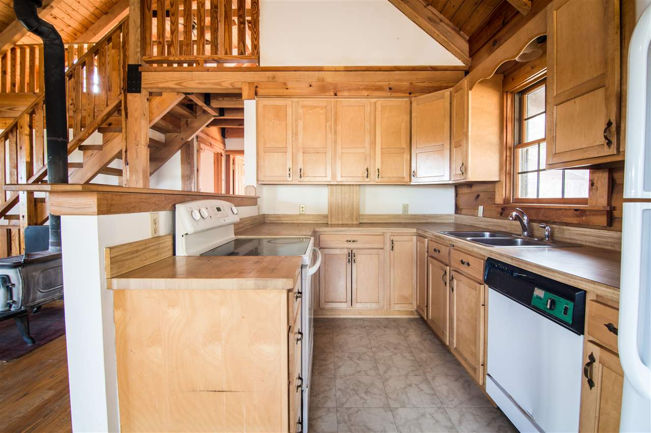 919 Roman Road Mount Sidney, VA 24467 - Photo 27 of 32 a kitchen with a sink a stove and a refrigerator