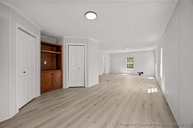 wooden floor with white walls