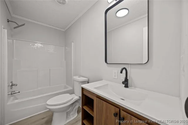 a view of a livingroom with wooden floor