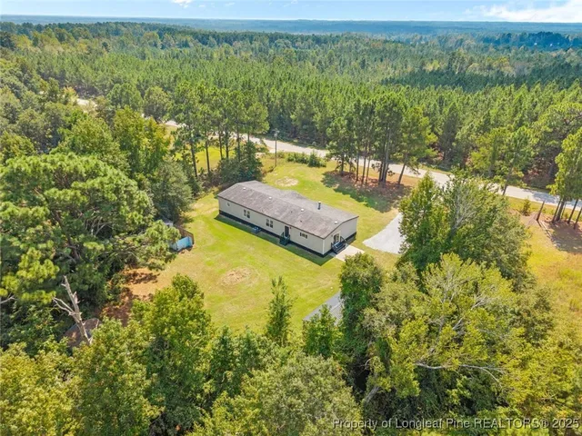 a view of a yard with an outdoor seating