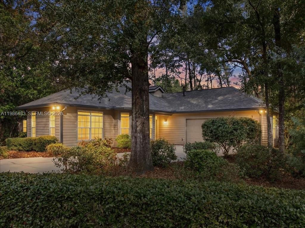 4412 Southwest 101 Drive Gainesville, FL 32608 - Photo 2 of 52 a front view of a house with garden